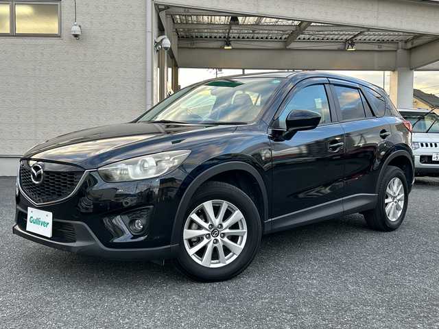 マツダ ＣＸ－５ XD 埼玉県 2013(平25)年 13.4万km ジェットブラックマイカ ・社外ナビBT、フルセグTV、/・バックカメラ/・プッシュスタート/・ETC/・空気圧センサー/・トラクションコントロール/・アイドリングストップ/・純正フロアマット/・ステアリングスイッチ/【メーカーオプション】/・ディスチャージパッケージ/ディスチャージパッケージの内容/ディスチャージヘッドランプ（ハイ／ロービーム：オートレベリング［光軸調整］機構付／バイキセノン）＋アダプティブ・フロントライティング・システム＋オートライトシステム＋レインセンサーワイパ―（フロント）感度調整式