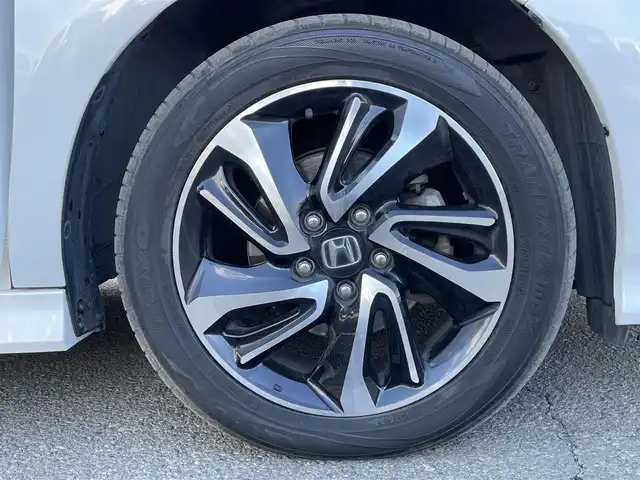 ホンダ ステップワゴン 東京都 2019(令1)年 10.4万km プラチナホワイトパール ユーザー買取車/社外ナビ【パナソニック　ストラーダ】/・AM/FM/SD/BT/TV/両側パワスラ/ホンダセンシング/・ACC（アダプティブクルーズコントロール）/・CMBS（追突軽減ブレーキ）/・LKAS（車線維持支援システム）/・誤発進抑制機能/・路外逸脱抑制機能/・先行車発信お知らせ機能/・標識認識機能/シートヒーター/パドルシフト/ビルトインＥＴＣ/ＥＣＯＮ/トリプルゾーンコントロール・フルオートエアコン/LEDヘッドライト（オートレベリング/オートライトコントロール機能）/スポーツペダル/純正フロアマット/ドアバイザー/プッシュスタート