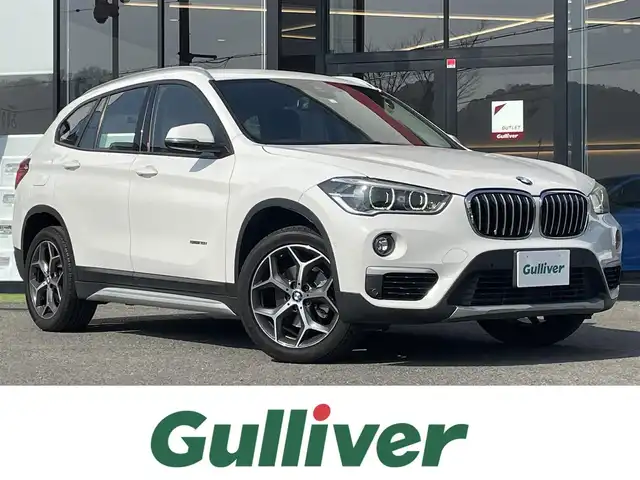 ＢＭＷ Ｘ１ sDrive 18i Xライン 大阪府 2016(平28)年 6.4万km アルピンホワイトⅢ ・純正ナビ/・バックカメラ/・衝突軽減システム/・レーンキープアシスト/・ハーフレザーシート/・ETC/・MTモード付きAT/・ドライブレコーダー/・フロアマット/・純正18インチAW/・LEDヘッドライト/・ルーフレール/・カーテンエアバック/・取説