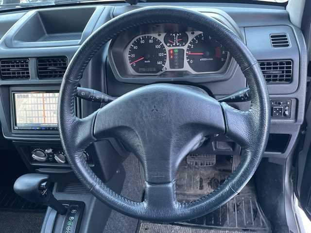 三菱 パジェロ ミニ アクティブフィールドED 道東・釧路十勝 2005(平17)年 8.4万km シンフォニックシルバー 4WD/社外ナビ/・ワンセグ・FM・AM/シートヒーター/アクティブフィールドエディション専用スペアタイヤケース/フォグランプ/ETC