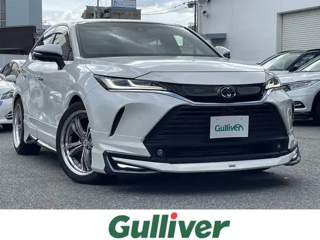 トヨタ ハリアー Z 福岡県 2020(令2)年 5.9万km ホワイトパールクリスタルシャイン ワンオーナー/モデリスタエアロ（フロント/サイド/リア）/調光パノラマルーフ/JBLプレミアムサウンド/メーカーナビ/（フルセグTV/FM/AM）/デジタルインナーミラー/全方位モニター/レーダークルーズコントロール/ビルトインETC2.0/電動パーキングブレーキ/オートブレーキホールド/トヨタセーフティセンス/‐プリクラッシュセーフティ/‐ブラインドスポットモニター/‐レーンキープアシスト/‐コーナーセンサー/ハーフレザーシート/運転席パワーシート/社外20インチアルミ（マーベリック）/TEIN車高調/プッシュスタート/スペアキー×１