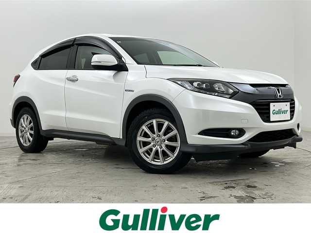 ホンダ ヴェゼル ハイブリッド X 宮城県 2014(平26)年 10.3万km ホワイトオーキッドパール 禁煙車/シティブレーキアクティブシステム/リアクティブフォースペダル/クルーズコントロール/前席シートヒーター/純正7インチナビ/（BT.AM.FM.CD.DVD.SD.USB.Ipod）/バックカメラ/フルセグテレビ/ETC/電動パーキングブレーキ/AUTOHOLD/パドルシフト/革巻きステアリング/ステアリングスイッチ/プッシュスタート/スマートキー/スペアキー/純正フロアマット/ドアバイザー/LEDヘッドライト/フォグランプ/社外16インチアルミホイール/純正16インチアルミホイール付夏タイヤ積込/（215/60/16）/ECON/横滑り防止機能