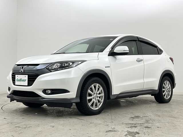 ホンダ ヴェゼル ハイブリッド X 宮城県 2014(平26)年 10.3万km ホワイトオーキッドパール 禁煙車/シティブレーキアクティブシステム/リアクティブフォースペダル/クルーズコントロール/前席シートヒーター/純正7インチナビ/（BT.AM.FM.CD.DVD.SD.USB.Ipod）/バックカメラ/フルセグテレビ/ETC/電動パーキングブレーキ/AUTOHOLD/パドルシフト/革巻きステアリング/ステアリングスイッチ/プッシュスタート/スマートキー/スペアキー/純正フロアマット/ドアバイザー/LEDヘッドライト/フォグランプ/社外16インチアルミホイール/純正16インチアルミホイール付夏タイヤ積込/（215/60/16）/ECON/横滑り防止機能