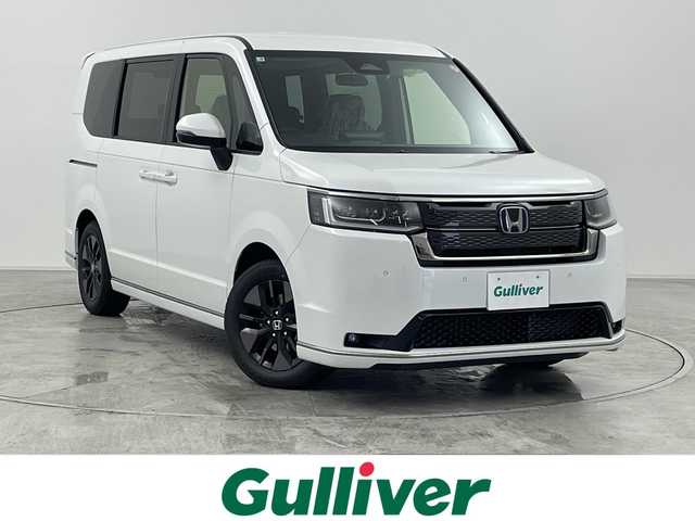 ホンダ ステップワゴン スパーダ eHEV 群馬県 2025(令7)年 0.1万km未満 プラチナホワイトパール 登録済未使用車　純正１１．４型ナビ　バックカメラ　電動リアゲート　両側電動スライドドア　パドルシフト　ＢＳＭ　アダプティブクルーズコントロール　電動パーキングブレーキ　シートヒーター　ＬＥＤ　禁煙車