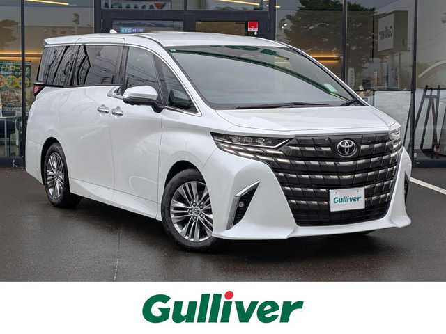 トヨタ アルファード Z 福井県 2024(令6)年 0.7万km プラチナホワイトパールマイカ 純正18インチAW/全方位カメラ/ガラスルーフ/デジタルインナーミラー/R・Fフォグ/後席用フリップダウンモニター/ビルトインETC2.0/１００V充電/ワイヤレス充電/電動リアゲート/オットマン/前席パワーシート/シートヒーター・エアシート/両側パワースライドドア/ステアリングヒーター/全車速追従機能付クルーズコントロール/前後コーナーセンサー/SOSボタン/前方ドライブレコーダー/衝突被害軽減システム/純正メモリナビ