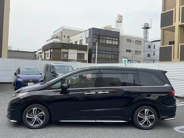 ホンダ オデッセイ アブソルート・Xホンダセンジング 広島県 2017(平29)年 6.8万km クリスタルブラックパール /登録時走行距離/　　　　　　　67602キロ/アイドリングストップ/純正ナビ/バックカメラ/地デジ/ハーフレザーシート/クルーズコントロール/両側パワースライドドア/社外フリップダウンモニター/　　【TVM-FW1020】/ビルトインETC/新車時整備手帳/　　【保証書】/取扱説明書/