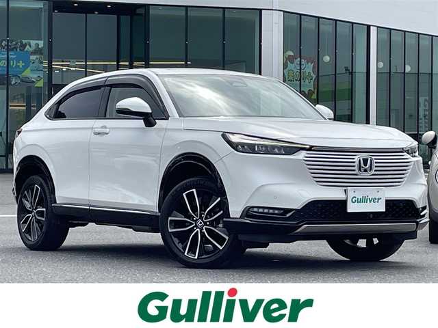 ホンダ ヴェゼル ハイブリッド e:HEV Z 島根県 2021(令3)年 6.5万km プラチナホワイトパール 登録時走行距離64887km/ワンオーナー/取扱説明書/保証書/純正ナビ/フルセグテレビ/バックカメラ/衝突軽減ブレーキ/レーダークルーズコントロール/ブラインドスポットモニター/プッシュスタート/前席シートヒーター/パワーバックドア/ハンドルヒーター/ヒルディセントコントロール/置くだけ充電/パドルシフト/LEDヘッドライト/前後ドライブレコーダー/ビルトインETC2.0/純正18インチアルミ