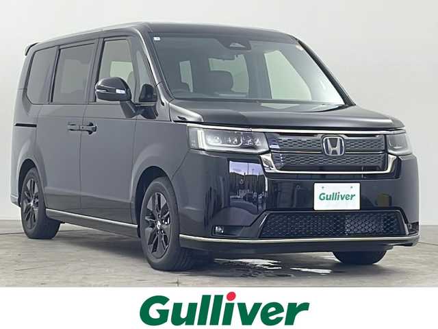 ホンダ ステップワゴン スパーダ eHEV 千葉県 2025(令7)年 0.1万km未満 クリスタルブラックパール 11.4インチ　Honda CONNECTナビ /フルセグTV　CD　DVD　Bluetooth/バックカメラ/両側パワースライドドア/オートライト/オートハイビーム/コーナーセンサー/ホンダセンシング/・衝突軽減ブレーキ/・レーンキープアシスト/・先行車発進お知らせ/・アダプティブクルーズコントロール/・誤発進抑制機能/・パーキングセンサーシステム/パドルシフト/電子パーキング/ブレーキホールド/ブラインドスポットモニター/純正16インチアルミホイール/パワーバックドア/2列目オットマン/シートヒーター/USB・タイプC入力端子/電動格納ミラー