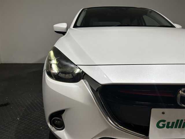 マツダ デミオ XD ツーリング Lパッケージ 愛媛県 2015(平27)年 4.4万km スノーフレイクホワイトパールマイカ ・純正ナビ（ワンセグＴＶ・ＢＴオーディオ・ＣＤＤＶＤ・ＦＭ・ＡＭ・ＡＵＸ）/・バックカメラ　/・ＵＳＢ接続　/・ＥＴＣ　/・クルーズコントロール　/・オートライト　/・ステアリングリモコン　/・ブラインドスポットモニター/・衝突軽減ブレーキ/・車検逸脱警報/・スペアキー/・ヘッドアップディスプレイ