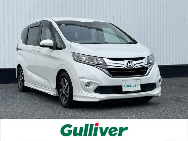 ホンダ フリード G ホンダセンシング 千葉県 2018(平30)年 4万km ホワイトオーキッドパール 純正メモリナビ/(フルセグTV CD DVD BT FM AM)/ナビ連動ドライブレコーダー/バックカメラ/衝突被害軽減システム/車線逸脱警報/クルーズコントロール/ハーフレザーシート/両側パワースライドドア/横滑り防止装置/ビルトインETC/アイドリングストップ/LEDヘッドライト/フォグランプ/オートライト/ウィンカーミラー/電動格納ミラー/純正15インチAW/シートリフター/プッシュスタート/スマートキー/フロアマット/ドアバイザー/取扱説明書/保証書/モデューロエアロ（F/S）