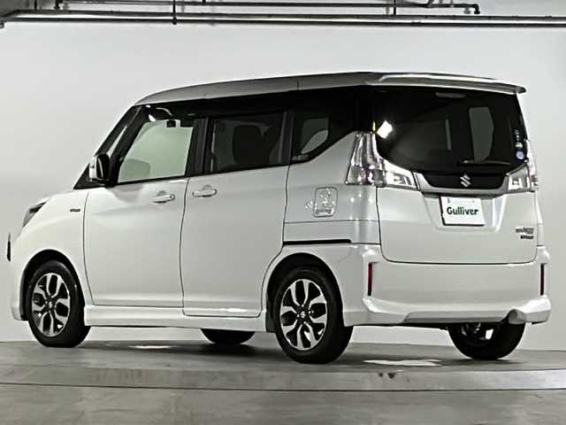スズキ ソリオ バンディット HV MV Dカメラ ブレーキS 広島県 2018(平30)年 2.7万km ピュアホワイトP デュアルカメラブレーキサポート/車線逸脱警報/クルーズコントロール/純正8型ナビ（CN-RZ83）/・フルセグTV/・CD/DVD/・Bluetooth/・SD/音楽録音/USB/全方位カメラ/両側パワースライドドア/革巻きステアリング/ステアリングスイッチ/オートライト/シートヒーター（D席）/前方ドライブレコーダー（TZ-D204）/シートバックテーブル/リアサンシェード/純正ドアバイザー/純正ETC/スマートキー/プッシュスタート/スペアキー/コーナーポール/純正15インチアルミホイール/W+サイドエアバック