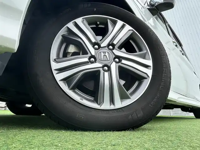 ホンダ ステップワゴン スパーダ ハイブリッド G ホンダセンシング 香川県 2018(平30)年 6.7万km プラチナホワイトパール 登録時走行距離：66111km/衝突被害軽減装置/純正9型ナビゲーション/→フルセグTV/→CD/DVD再生/バックカメラ/ビルトインETC/ドライブレコーダー/クルーズコントロール/ステアリングリモコン/革巻きステアリング/LECオートライト/フォグランプ/純正フロアマット/後席サンシェード/横滑り防止装置/レーンキープアシスト/盗難防止装置/スマートキー/スペアキー