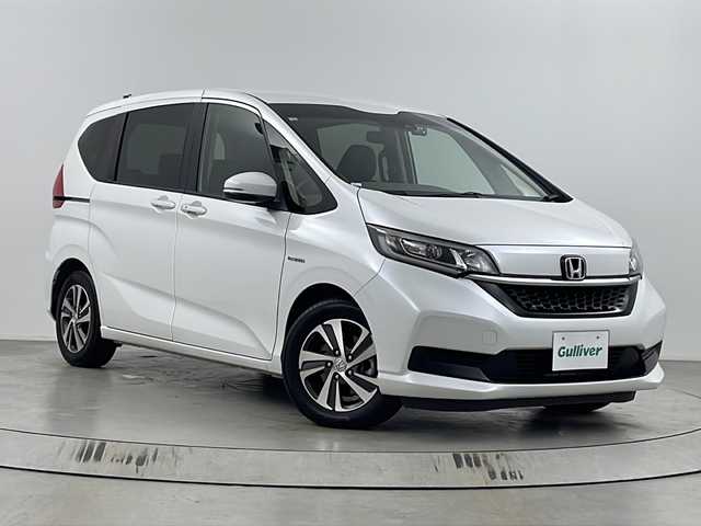 ホンダ フリード ハイブリット G ホンダセンシング 埼玉県 2019(令1)年 4.3万km プラチナホワイトパール 社外ナビ　MDV-D206BT/(Bluetooth/CD/DVD/USB/AM/FM)/バックカメラ/前方ドライブレコーダー/ETC/アダプティブクルーズコントロール/車線逸脱警報/衝突軽減ブレーキ/先行車発進お知らせ機能/標識認識機能/両側パワースライドドア/プッシュスタート/ステアリングリモコン/ウィンカーミラー/社外フロアマット/純正１５インチアルミホイール