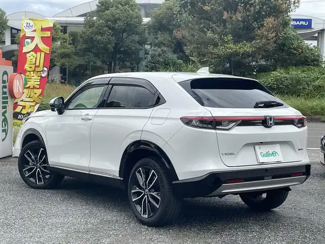 ホンダ ヴェゼル ハイブリッド e:HEV Z 神奈川県 2021(令3)年 1.2万km プラチナホワイトパール ワンオーナー/ホンダコネクトナビ/・フルセグTV/BT/全方位カメラ、バックカメラ/純正前後ドライブレコーダー/ビルトインETC2.0/置くだけ充電/ホンダセンシング/・レーンキープ/・ブラインドスポットインフォメーション/・踏み間違い衝突軽減システム/・衝突軽減ブレーキ（CMBS）/ハーフレザーシート/・前席シートヒーター/コーナーセンサー/パワーバックドア/ステアリングヒーター/純正18インチAW/LEDヘッドライト/フォグランプ/スマートキー/横滑り防止装置/ドアバイザー/純正フロアマット/保証書/取扱説明書/スペアキー×1