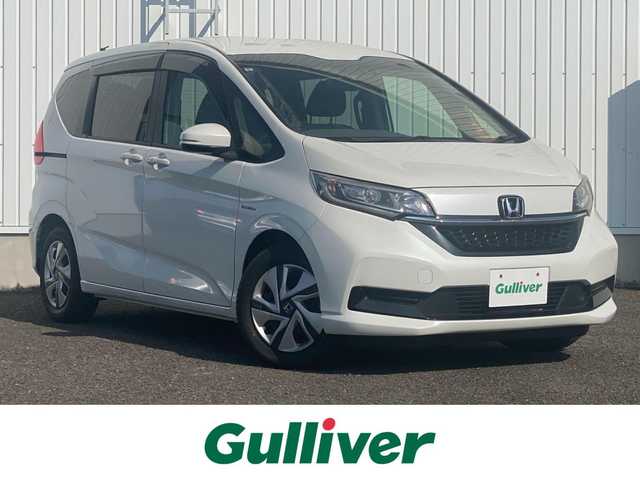 ホンダ フリード ハイブリット G ホンダセンシング 熊本県 2021(令3)年 5.8万km プラチナホワイトパール 純正ナビ/AM/FM/SD/USB/フルセグTV/バックカメラ/先行車発進お知らせ機能/路外逸脱抑制システム/レーンキープアシスト/標識認識機能/LEDヘッドライト/両側パワースライドドア/D+N席シートヒーター/ステアリングスイッチ/電動格納ウィンカーミラー/ドアバイザー/純正フロアマット/ETC/プッシュスタート/スマートキー
