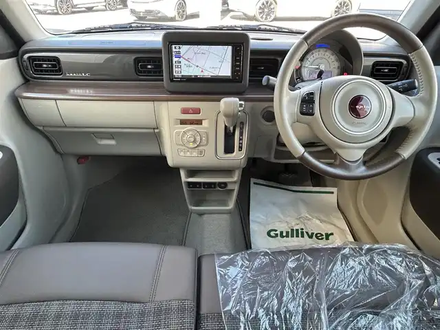 スズキ ラパン ＬＣ X 栃木県 2022(令4)年 2.5万km フォーンベージュメタリック/アーバンブラウン 2トーン 純正メモリナビ/(CD/DVD/BT/AM/FM)/フルセグTV/全周囲カメラ/ハーフレザーシート/シートヒーター/衝突被害軽減システム/車線逸脱警報/コーナーセンサー前後/ETC/LEDヘッドライト/オートライト/アイドリングストップ/ウィンカーミラー/電動格納ミラー/純正14インチAW/シートリフター/横滑り防止装置/プッシュスタート/スマートキー/フロアマット/ドアバイザー/取扱説明書/保証書