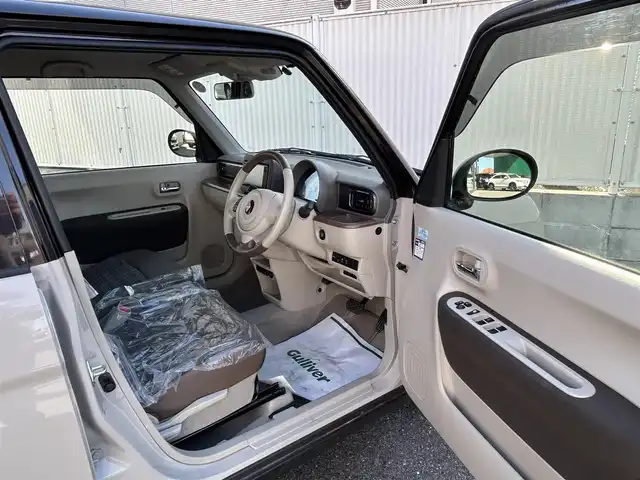 スズキ ラパン ＬＣ X 栃木県 2022(令4)年 2.5万km フォーンベージュメタリック/アーバンブラウン 2トーン 純正メモリナビ/(CD/DVD/BT/AM/FM)/フルセグTV/全周囲カメラ/ハーフレザーシート/シートヒーター/衝突被害軽減システム/車線逸脱警報/コーナーセンサー前後/ETC/LEDヘッドライト/オートライト/アイドリングストップ/ウィンカーミラー/電動格納ミラー/純正14インチAW/シートリフター/横滑り防止装置/プッシュスタート/スマートキー/フロアマット/ドアバイザー/取扱説明書/保証書