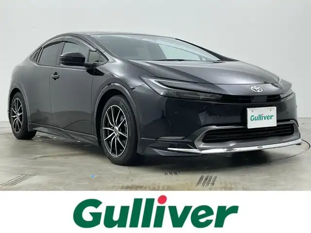 トヨタ プリウス 岡山県 2024(令6)年 1万km アティチュードブラックマイカ モデリスタエアロ　前・横・後下　/純正ディスプレイオーディオ/【BT/フルセグ/Carplay】/全方位カメラ　/レーダークルーズコントロール　/ＥＴＣ２．０　/シートヒーター　前席　/エアシート　前席　/ＬＥＤヘッドライト　/ワイヤレス充電　/デジタルインナーミラー　/ブラインドスポットモニター　/電動リアゲート/禁煙車/スペアキー×1/コーナーセンサー　前後/ステアリングヒーター/パーキングアシスト