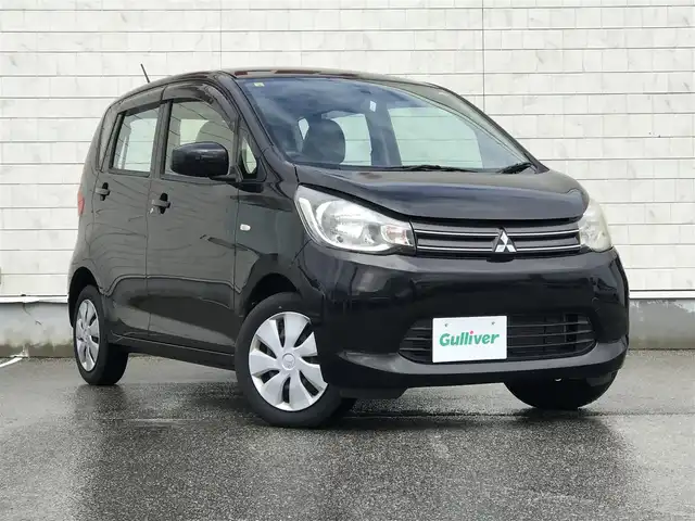 三菱 ｅＫワゴン E 富山県 2014(平26)年 4.5万km アメジストブラック スタッドレスタイヤ車載/社外ナビ/ワンセグTV/Bluetooth/リモコンキー/電動格納ミラー/ETC/ヘッドライトレベライザー/ベンチシート/ドアバイザー/パワーウインドウ/パワーステアリング