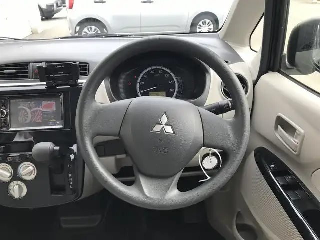 三菱 ｅＫワゴン E 富山県 2014(平26)年 4.5万km アメジストブラック スタッドレスタイヤ車載/社外ナビ/ワンセグTV/Bluetooth/リモコンキー/電動格納ミラー/ETC/ヘッドライトレベライザー/ベンチシート/ドアバイザー/パワーウインドウ/パワーステアリング