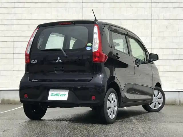 三菱 ｅＫワゴン E 富山県 2014(平26)年 4.5万km アメジストブラック スタッドレスタイヤ車載/社外ナビ/ワンセグTV/Bluetooth/リモコンキー/電動格納ミラー/ETC/ヘッドライトレベライザー/ベンチシート/ドアバイザー/パワーウインドウ/パワーステアリング
