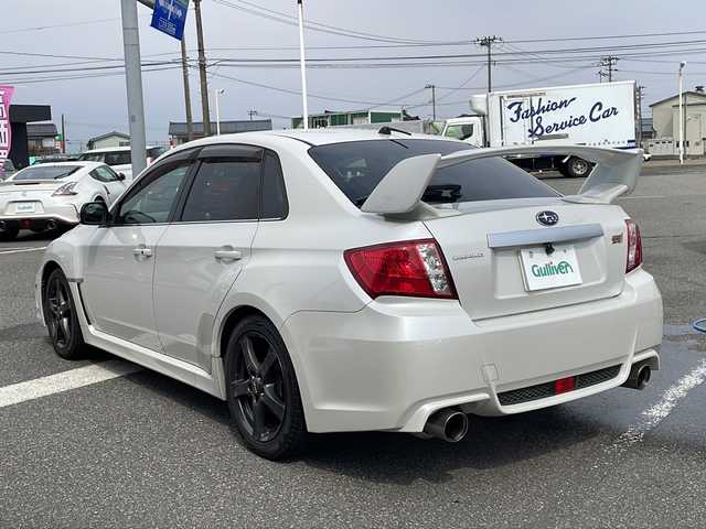 スバル インプレッサ ＷＲＸ STI A－Line 新潟県 2012(平24)年 10.7万km サテンホワイトパール 社外ナビ/HKSマフラー/大型トランクスポイラー/ハーフレザーシート/バックカメラ/パワーシート/キセノンライト/プッシュスタート