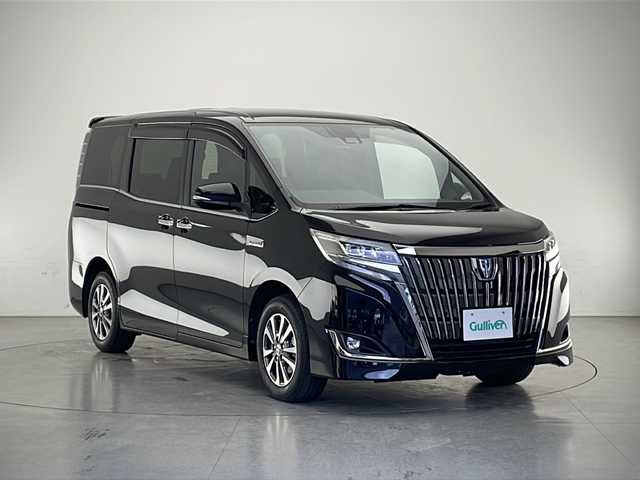 トヨタ エスクァイア ハイブリッド Gi プレミアムパッケージ ブラックテーラード 長野県 2020(令2)年 2.6万km ブラック 純正9インチナビ/両側パワースライドドア/トヨタセーフティセンスC/クルーズコントロール/ドライブレコーダー/パーキングサポートブレーキ/クリアランスソナー/バックカメラ/先行車発進お知らせ/フルセグTV/Bluetooth/CD/DVD/USB/HDMI/ビルトインETC（DSRC）/シートヒーター（運転席、助手席）/オートライト/LEDヘッドライト/オートマチックハイビーム/フォグランプ/ステアリングスイッチ/ステアリングヒーター/革巻きステアリング/純正フロアマット/純正アルミホイール/2列目サンシェード/電動格納ミラー/ウインカーミラー/ドアバイザー