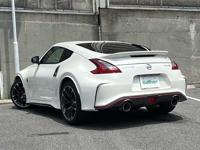 日産 フェアレディ Ｚ ニスモ 愛知県 2019(令1)年 1.7万km ブリリアントホワイトパール nismo専用エアロ/BOSEプレミアムサウンド/純正メーカーHDDナビ/フルセグTV・Bluetooth・CD・DVD・AM・FM・AUX/バックカメラ/純正レカロハーフレザーシート/nismoマフラー/レッドブレーキキャリパー/nismoカーボンキッキングプレート/HIDヘッドライト/純正19インチAW/ビルトインETC/センターコンソール/USBポート/ステアリングスイッチ/スマートキー/プッシュスタート/nismoフロアマット/電動格納ミラー/取扱説明書/保証書/スペアスマートキー