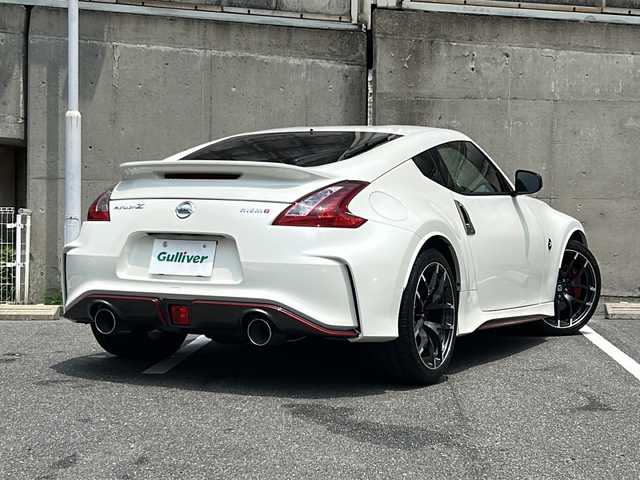 日産 フェアレディ Ｚ ニスモ 愛知県 2019(令1)年 1.7万km ブリリアントホワイトパール nismo専用エアロ/BOSEプレミアムサウンド/純正メーカーHDDナビ/フルセグTV・Bluetooth・CD・DVD・AM・FM・AUX/バックカメラ/純正レカロハーフレザーシート/nismoマフラー/レッドブレーキキャリパー/nismoカーボンキッキングプレート/HIDヘッドライト/純正19インチAW/ビルトインETC/センターコンソール/USBポート/ステアリングスイッチ/スマートキー/プッシュスタート/nismoフロアマット/電動格納ミラー/取扱説明書/保証書/スペアスマートキー