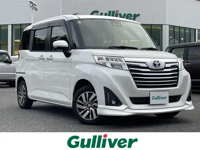 トヨタ ルーミー カスタムG 島根県 2019(令1)年 2.5万km パールホワイトⅢ 登録時走行距離24911km/純正ナビ(AM/FM/Bluetooth/CD/DVD)/フルセグテレビ/全方位カメラ/両側パワースライドドア/クルーズコントロール/コーナーセンサー/純正アルミホイール/LEDヘッドライト/オートマチックハイビーム/ドライブレコーダー前後/衝突軽減システム/ステアリングスイッチ/スマートキー/プッシュスタート/シートヒーター