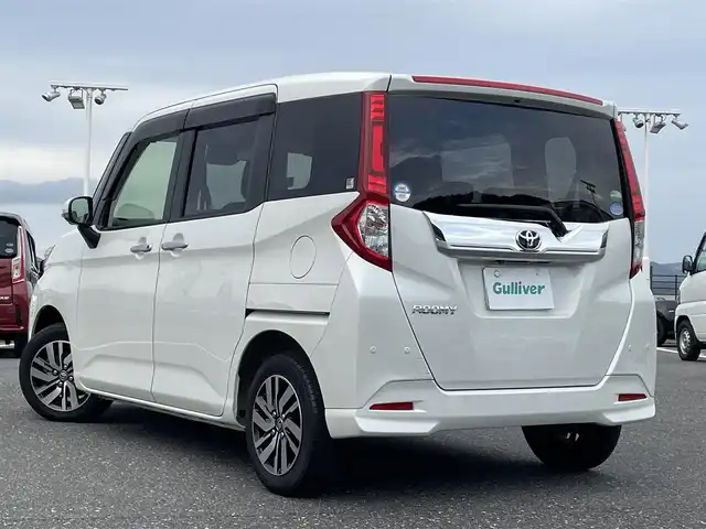 トヨタ ルーミー カスタムG 島根県 2019(令1)年 2.5万km パールホワイトⅢ 登録時走行距離24911km/純正ナビ(AM/FM/Bluetooth/CD/DVD)/フルセグテレビ/全方位カメラ/両側パワースライドドア/クルーズコントロール/コーナーセンサー/純正アルミホイール/LEDヘッドライト/オートマチックハイビーム/ドライブレコーダー前後/衝突軽減システム/ステアリングスイッチ/スマートキー/プッシュスタート/シートヒーター