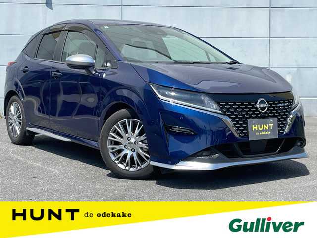 日産 ノート オーテック 千葉県 2021(令3)年 2.8万km オーロラフレアブルーパール プロパイロット/　衝突軽減ブレーキ/レーンキープアシスト/　レーダークルーズコントロール/オートハイビーム/　クリアランスソナー/ブラインドスポットモニター/メーカー純正コネクトナビ/　フルセグ/BT/USB/カープレイ/アラウンドビューモニター/デジタルインナーミラー/ステアリングスイッチ/ETC/ワイヤレス充電/レザーシート(黒/青)/電動パーキングブレーキ/LEDヘッドライト/オートライト/フォグライト/スマートキー/プッシュスタート/オーテック16インチAW/純正フロアマット/電動格納ミラー/アイドリングストップ