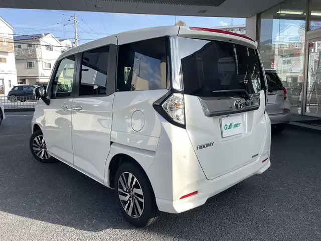 トヨタ ルーミー カスタムG 大阪府 2023(令5)年 1万km パールホワイトⅢ ワンオーナー/純正メモリーナビ/　フルセグTV/　Bluetooth/　DVD再生/　AM/FM/全方位カメラ/バックカメラ/スマートアシストIII/　衝突軽減ブレーキ/　車線逸脱警報/　先行車発信お知らせ/　ふらつき警報/　誤発進抑制制御/　オートハイビーム/レーダークルーズコントロール/純正ＬＥＤライト/スマートキー/両側パワースライドドア/フロントシートヒーター/ドラレコ/スペアキー1本（スマートキー）