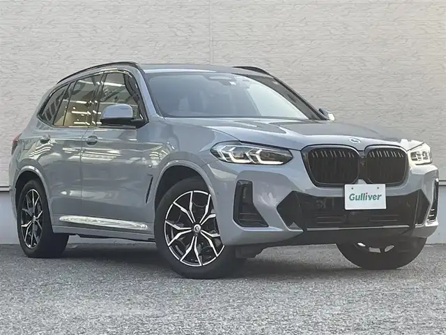 ＢＭＷ ＢＭＷ Ｘ３ xDrive20d Mスポーツ 大阪府 2023(令5)年 2.2万km グレー サンルーフ/純正HDDナビ/BT/USB/フルセグTV/haraman/kardonサウンド/360度カメラ/パーキングアシスト/黒革シート/D/N席パワーシート/D/N席エアシート/全席シートヒーター/ステアリングヒーター/後席ロールサンシェード/追従機能付きクルーズコントロール/レーンキープアシスト/ブラインドスポットモニター/前後ドライブレコーダー/前後コーナーセンサー/パドルシフト/オートホールド/LEDヘッドライト/オートハイビーム/アクティブフロントライトシステム/純正フロアマット/純正19インチAW/ETC2.0/スペアキー