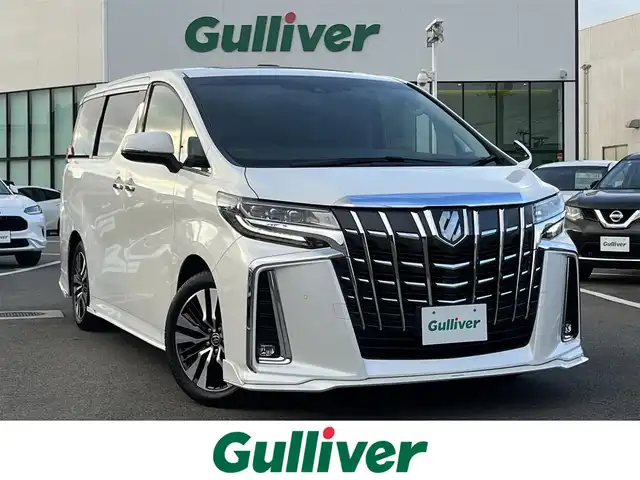 トヨタ アルファード S Cパッケージ 愛媛県 2021(令3)年 6.7万km ホワイトパールクリスタルシャイン 禁煙車/登録時走行距離66683km/純正ナビ/CD/DVD/フルセグTV/フリップダウンモニター/バックカメラ/ビルトインETC/ドライブレコーダー/デジタルインナーミラー/衝突被害軽減ブレーキ/レーンキープサポート/ブラインドスポットモニター/クルーズコントロール/コーナーセンサー/ムーンルーフ/両側パワースライドドア/前後左右独立オートエアコン/革シート/シートヒーター/シートベンチレーション/パワーバックドア/革巻きステアリングホイール/ステアリングヒーター/オートライト/オートマチックハイビーム/LEDヘッドランプ/フォグランプ/純正18インチアルミ/スマートエントリー