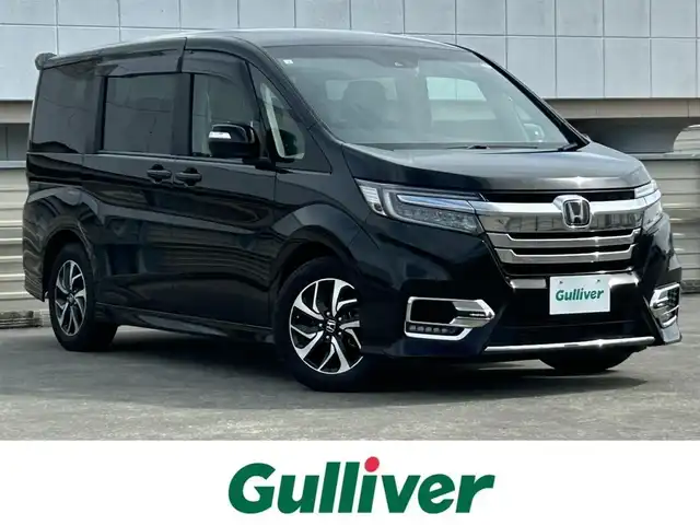 ホンダ ステップワゴン スパーダ ホンダセンシング 静岡県 2019(平31)年 7.4万km プレミアムスパークルブラックパール 8人乗り/純正10インチナビ/（Bluetooth/CD/DVD/USB/SD/FM/AM）/バックカメラ/純正後席モニター/両側電動スライドドア/ETC/デュアルエアコン/プッシュスタート/スマートキー/LEDヘッドライト/追従クルーズコントロール/純正16AW