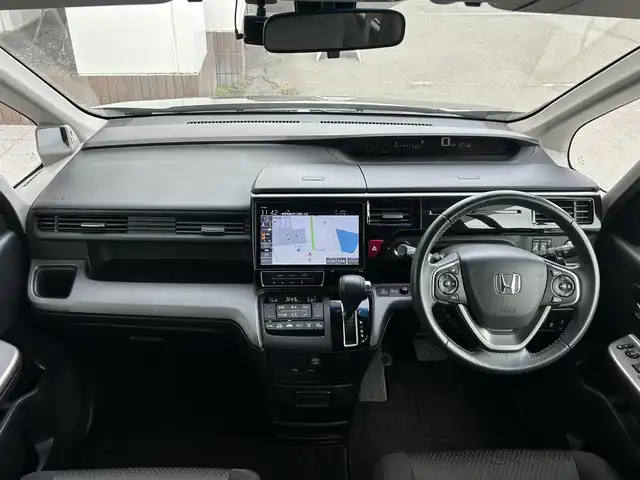 ホンダ ステップワゴン スパーダ ホンダセンシング 静岡県 2019(平31)年 7.4万km プレミアムスパークルブラックパール 8人乗り/純正10インチナビ/（Bluetooth/CD/DVD/USB/SD/FM/AM）/バックカメラ/純正後席モニター/両側電動スライドドア/ETC/デュアルエアコン/プッシュスタート/スマートキー/LEDヘッドライト/追従クルーズコントロール/純正16AW