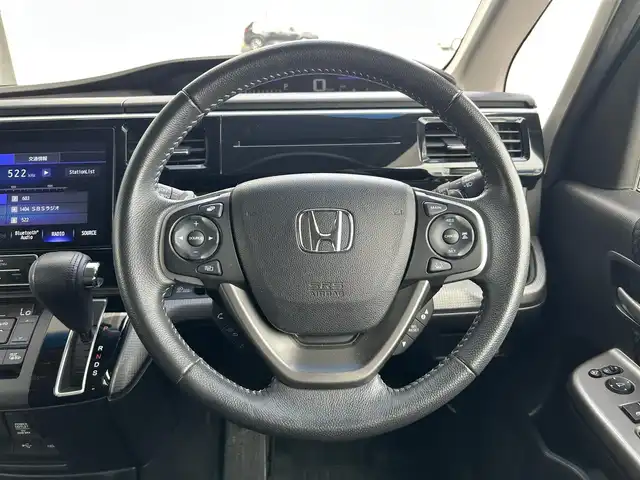 ホンダ ステップワゴン スパーダ ホンダセンシング 静岡県 2019(平31)年 7.4万km プレミアムスパークルブラックパール 8人乗り/純正10インチナビ/（Bluetooth/CD/DVD/USB/SD/FM/AM）/バックカメラ/純正後席モニター/両側電動スライドドア/ETC/デュアルエアコン/プッシュスタート/スマートキー/LEDヘッドライト/追従クルーズコントロール/純正16AW
