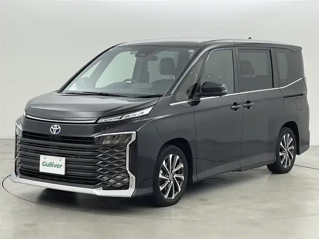 トヨタ ヴォクシー ハイブリッド S－Z 福岡県 2023(令5)年 2万km グリッターブラックガラスフレーク 純正１０．５型ＤＡナビ　/全方位カメラ　/ビルトインＥＴＣ２．０　/トヨタセーフティセンス　/レーダークルーズコントロール　/コーナーセンサー　/衝突軽減ブレーキ　/レーンキープ　/アクセル踏み間違い防止　/ＢＳＭ　/パーキングアシスト　/シートヒーター　/ハーフレザーシート　/両側パワースライドドア　/Wエアコン　/純正アルミホイール