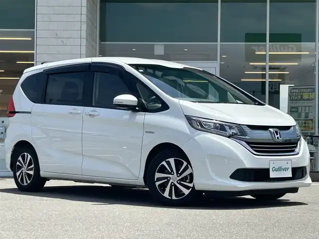 ホンダ フリード ハイブリット 兵庫県 2019(平31)年 6.4万km ホワイトオーキッドパール ホンダセンシング/レーダークルーズコントロール/前後ドライブレコーダー/純正フリップダウン/純正ナビ/両側パワースライドドア/ビルトインETC/Bluetooth接続/前席シートヒーター/フルセグTV/３列シート/スイッチスタート/LEDヘッドライト