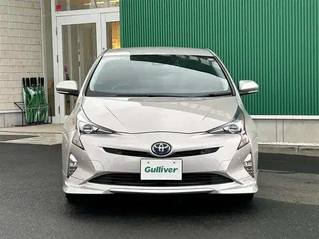 トヨタ プリウス A プレミアム　ツーリングセレ 宮城県 2016(平28)年 6万km スティールブロンドM 寒冷地仕様/・デアイサー/・リアフォグランプ/＝＝＝/エアロ（F/S/R）/セーフティセンス/・プリクラッシュセーフティ/・レーンディパーチャーアラート/・オートマチックハイビーム/・レーダークルーズコントロール/ブラインドスポットモニター/インテリジェントクリアランスソナー/シンプルインテリジェントパーキングアシスト/ヘッドアップディスプレイ/純正9インチナビ（DSZT-YC4T）/・CD/DVD/・Bluetooth/・フルセグTV/バックカメラ/ビルトインETC/ドライブレコーダー/AC100V/1500W/本革シート/シートヒーター/運転席パワーシート/革巻きステアリング/ステアリングスイッチ/LEDヘッドランプ/フォグランプ/オートライト/スマートキー＆プッシュスタート/電動格納ミラー/純正17インチAW/純正フロアマット/純正ドアバイザー/トノカバー/W/サイド/カーテンエアバッグ