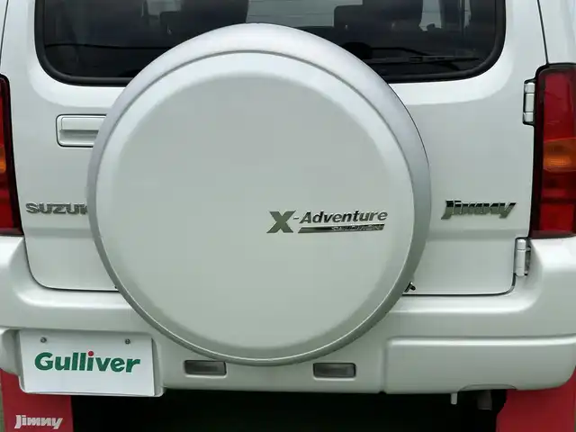 スズキ ジムニー クロスアドベンチャー 香川県 2013(平25)年 4万km パールホワイト 登録時走行距離：39626km/パートタイム４WD高低二段切り替式/純正7インチナビ/→ＣＤ／ＤＶＤ/→フルセグTV/→Bluetooth/シートヒーター/レザーシート/革巻きステアリング/純正16インチアルミホイール/電動格納ウィンカーミラー/純正フロアマット/バイザー/パワーステアリング/パワーウィンドウ