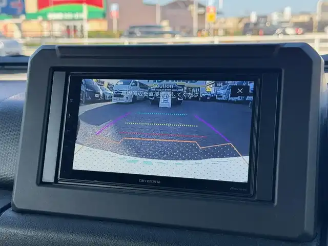 スズキ ジムニー シエラ JC 滋賀県 2023(令5)年 0.9万km ブルーイッシュブラックパール3 ワンオーナー/カロッツェリアディスプレイオーディオ/　Bluetooth FM AM/バックカメラ/デュアルセンサーブレーキサポート/誤発進抑制機能/車線逸脱警報機能/ふらつき警報機能/ハイビームアシスト/先行車発進お知らせ機能/標識認識機能/エマージェンシーストップシグナル/オートライトシステム/ライト自動消灯システム/ヒーテッドドアミラー/純正LEDヘッドライト/純正16インチアルミ/純正フロアマット/スマートキー×2/プッシュスタート/