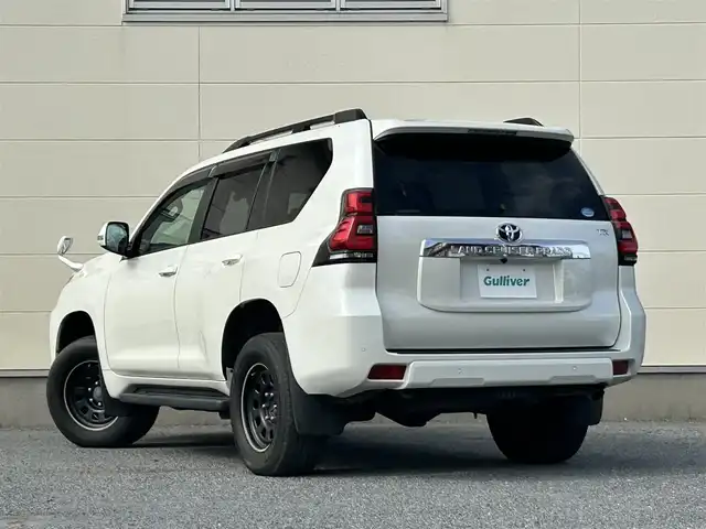 トヨタ ランドクルーザー プラド TX Lパッケージ 茨城県 2018(平30)年 6.9万km ホワイトパールクリスタルシャイン 純正ナビ　NZST-Y66T/　(AM/FM/フルセグ/Bluetooth)/バックカメラ/4WD/サンルーフ/7人乗り/ビルドインETC2.0/純正ドライブレコーダー/レーダークルーズコントロール/クリアランスソナー/革巻きステアリング/黒革シート/シートヒーター/シートエアコン/パワーシート/電動格納サードシート/ルーフレール/カーテンエアバッグ/LEDヘッドライト/オートマチックハイビーム/衝突被害軽減/レーンキープアシスト/スマートキー