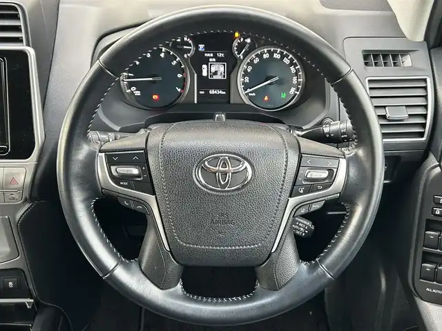 トヨタ ランドクルーザー プラド TX Lパッケージ 茨城県 2018(平30)年 6.9万km ホワイトパールクリスタルシャイン 純正ナビ　NZST-Y66T/　(AM/FM/フルセグ/Bluetooth)/バックカメラ/4WD/サンルーフ/7人乗り/ビルドインETC2.0/純正ドライブレコーダー/レーダークルーズコントロール/クリアランスソナー/革巻きステアリング/黒革シート/シートヒーター/シートエアコン/パワーシート/電動格納サードシート/ルーフレール/カーテンエアバッグ/LEDヘッドライト/オートマチックハイビーム/衝突被害軽減/レーンキープアシスト/スマートキー