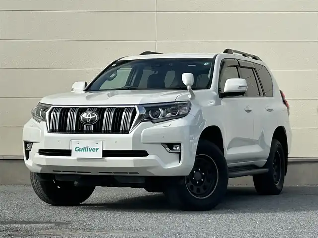 トヨタ ランドクルーザー プラド TX Lパッケージ 茨城県 2018(平30)年 6.9万km ホワイトパールクリスタルシャイン 純正ナビ　NZST-Y66T/　(AM/FM/フルセグ/Bluetooth)/バックカメラ/4WD/サンルーフ/7人乗り/ビルドインETC2.0/純正ドライブレコーダー/レーダークルーズコントロール/クリアランスソナー/革巻きステアリング/黒革シート/シートヒーター/シートエアコン/パワーシート/電動格納サードシート/ルーフレール/カーテンエアバッグ/LEDヘッドライト/オートマチックハイビーム/衝突被害軽減/レーンキープアシスト/スマートキー