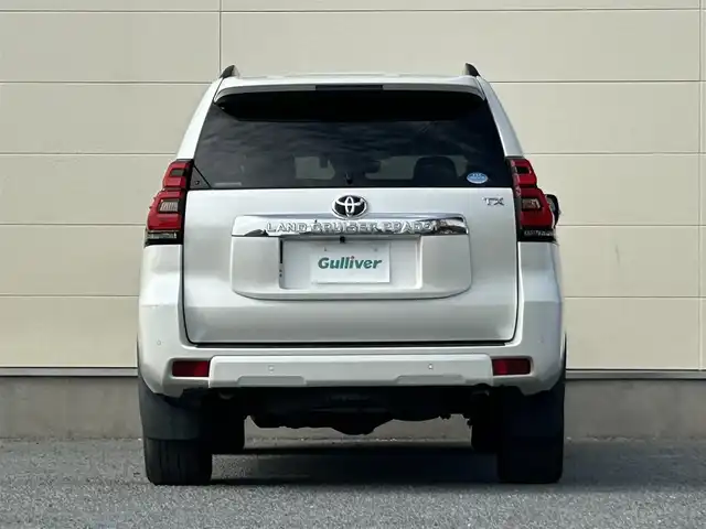 トヨタ ランドクルーザー プラド TX Lパッケージ 茨城県 2018(平30)年 6.9万km ホワイトパールクリスタルシャイン 純正ナビ　NZST-Y66T/　(AM/FM/フルセグ/Bluetooth)/バックカメラ/4WD/サンルーフ/7人乗り/ビルドインETC2.0/純正ドライブレコーダー/レーダークルーズコントロール/クリアランスソナー/革巻きステアリング/黒革シート/シートヒーター/シートエアコン/パワーシート/電動格納サードシート/ルーフレール/カーテンエアバッグ/LEDヘッドライト/オートマチックハイビーム/衝突被害軽減/レーンキープアシスト/スマートキー