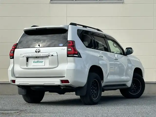 トヨタ ランドクルーザー プラド TX Lパッケージ 茨城県 2018(平30)年 6.9万km ホワイトパールクリスタルシャイン 純正ナビ　NZST-Y66T/　(AM/FM/フルセグ/Bluetooth)/バックカメラ/4WD/サンルーフ/7人乗り/ビルドインETC2.0/純正ドライブレコーダー/レーダークルーズコントロール/クリアランスソナー/革巻きステアリング/黒革シート/シートヒーター/シートエアコン/パワーシート/電動格納サードシート/ルーフレール/カーテンエアバッグ/LEDヘッドライト/オートマチックハイビーム/衝突被害軽減/レーンキープアシスト/スマートキー