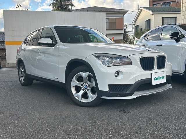 ＢＭＷ Ｘ１ sDrive 18i 東京都 2015(平27)年 5.2万km アルピンホワイトⅢ HDDナビ/バックカメラ/ETC2.0/CD/DVD/BT/USB/前後ドライブレコーダー付き/ウインカーミラー/電動格納ミラー/プッシュスタート/パーキングアシスト/横滑り防止装置/前後コーナーセンサー/オートマチックハイビーム/純正アルミホイール/純正LEDライト/トノカバー/スマートキー/保証書/取扱説明書