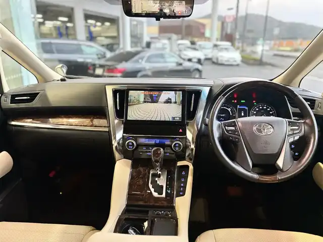 トヨタ アルファードハイブリット G 京都府 2019(平31)年 3.9万km ホワイトパールクリスタルシャイン ワンオーナー/4WD/純正10インチメモリーナビ、地デジ、Bluetooth/純正12インチ後部フリップダウンモニター/デジタルインナーミラー/本革シート（前席エアーシート/シートヒーター）/前席パワーシート/3眼LEDヘッドランプ/ビルトイン2.0ETC/両側パワースライドドア /パワーバックドア/運転席メモリーシート/USB端子/トヨタセーフティセンス/・プリクラッシュセーフティ/・ロードサインアシスト/・レーダークルーズコントロール/・オートマチックハイビーム/スペアキー/保証書/記録簿R4、R6